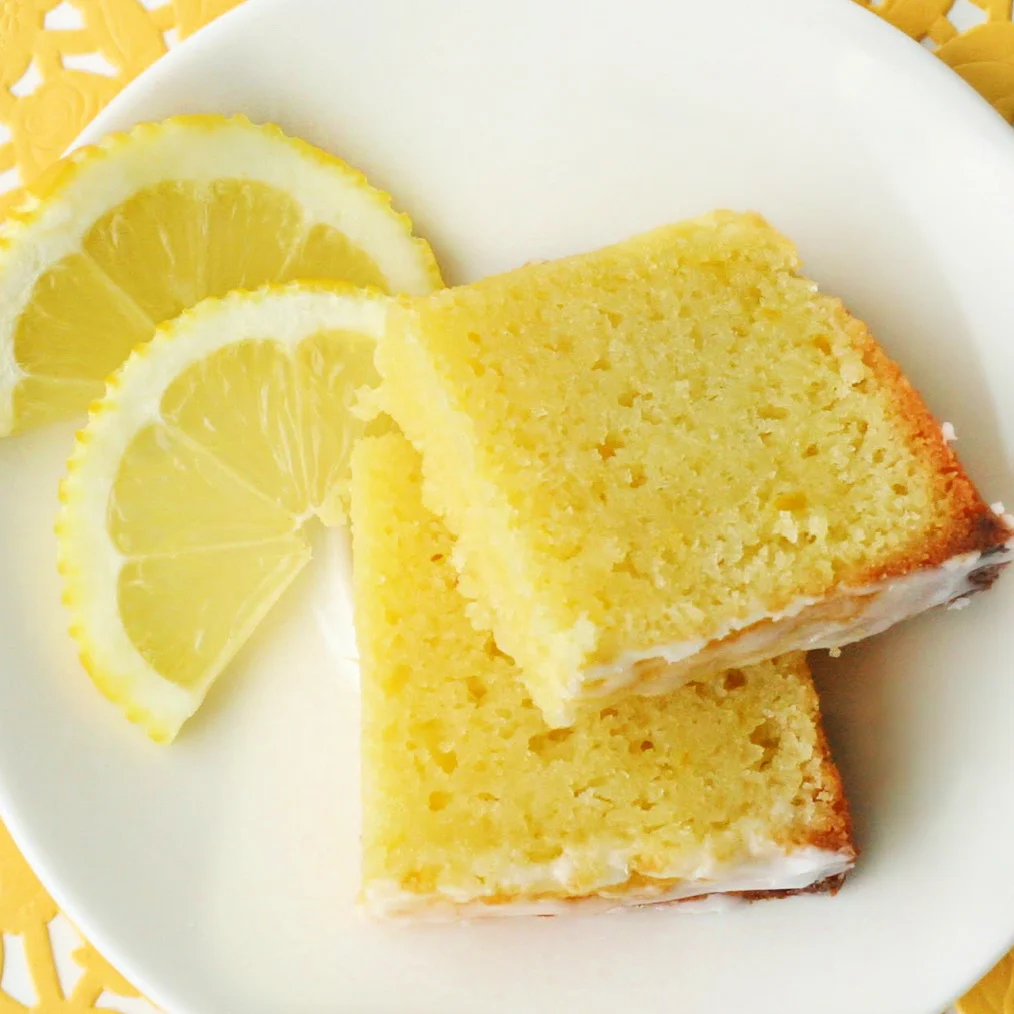 lemon-bread-slice-cut-in-half-on-white-plate-square